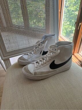 Nike White High-Top Sneakers with Black Swoosh